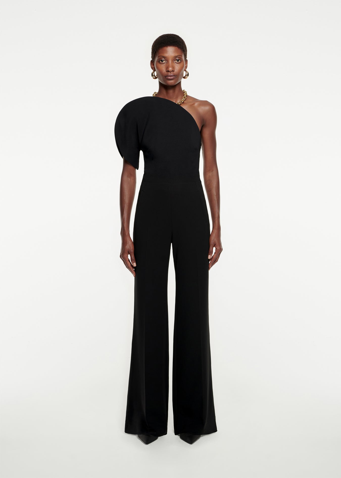 Woman wearing the Asymmetric Stretch-Cady Jumpsuit in Black
