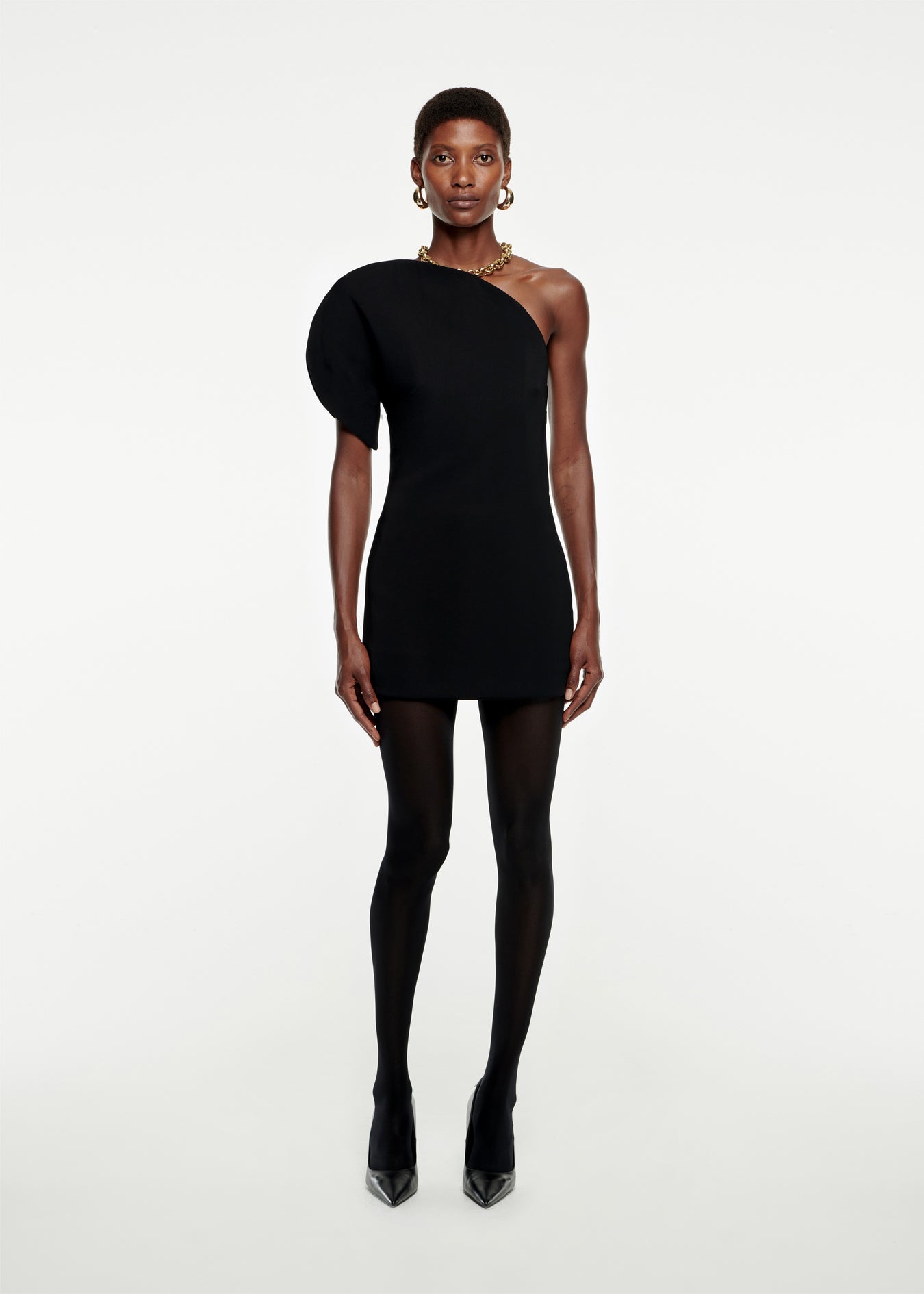 Woman wearing the Asymmetric Stretch-Cady Mini Dress in Black