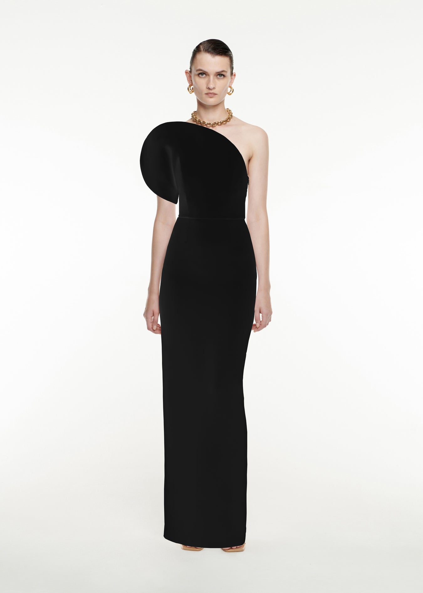 Woman wearing the Asymmetric Silk Wool Maxi Dress in Black