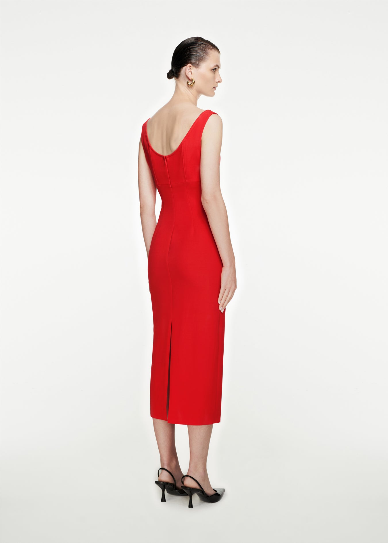 The back of a woman wearing the Off The Shoulder Silk Wool Midi Dress in Red