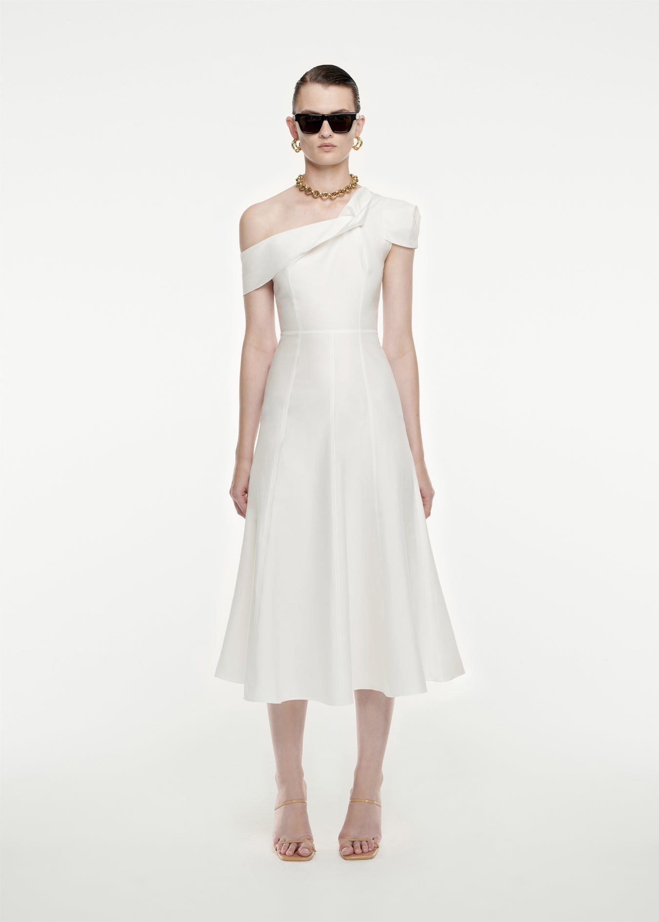 Woman wearing the Asymmetric Cotton Poplin Midi Dress in White