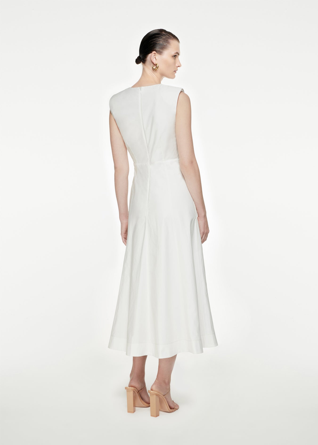 The back of a woman wearing the Cotton Poplin Midi Dress in White