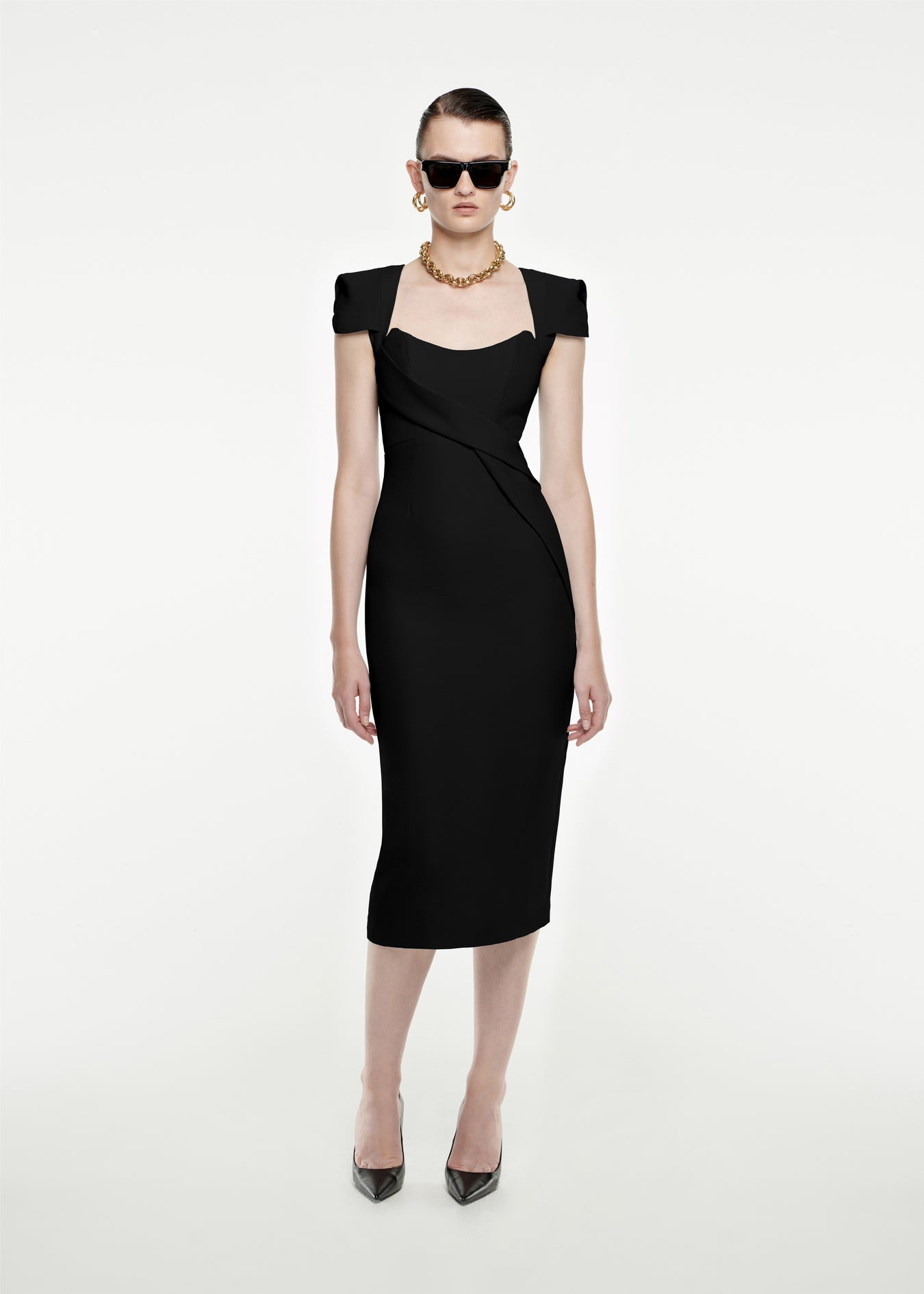 Woman wearing the Cap Sleeve Silk Wool Midi Dress in Black